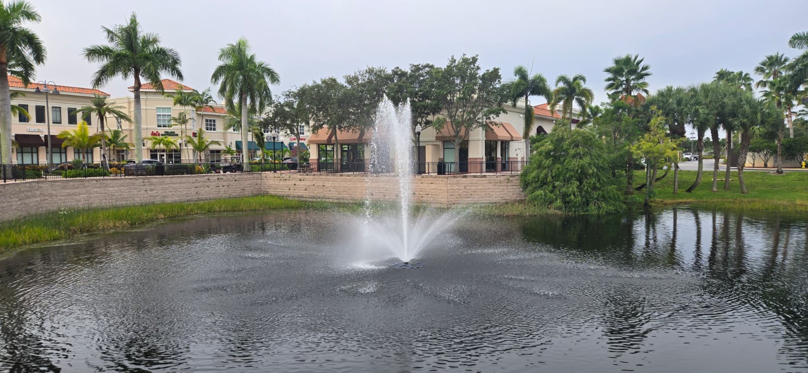Commercial Project - Pressure Cleaning/Pressure Washing three Retaining Wall in lake located at Legacy Place in Palm Beach Gardens, FL 33410