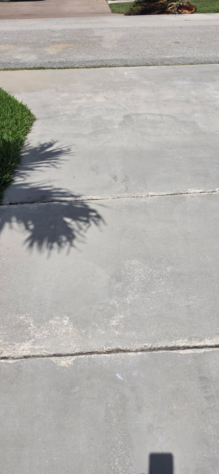 Oil Stain removal on concrete driveway located in Boynton Beach Florida 33437