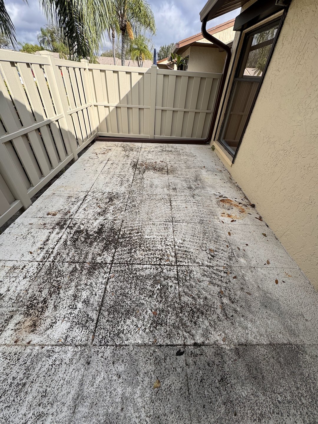 Pressure washing/Pressure Cleaning of concrete patio and rust stain removal in West Palm Beach FL 33409