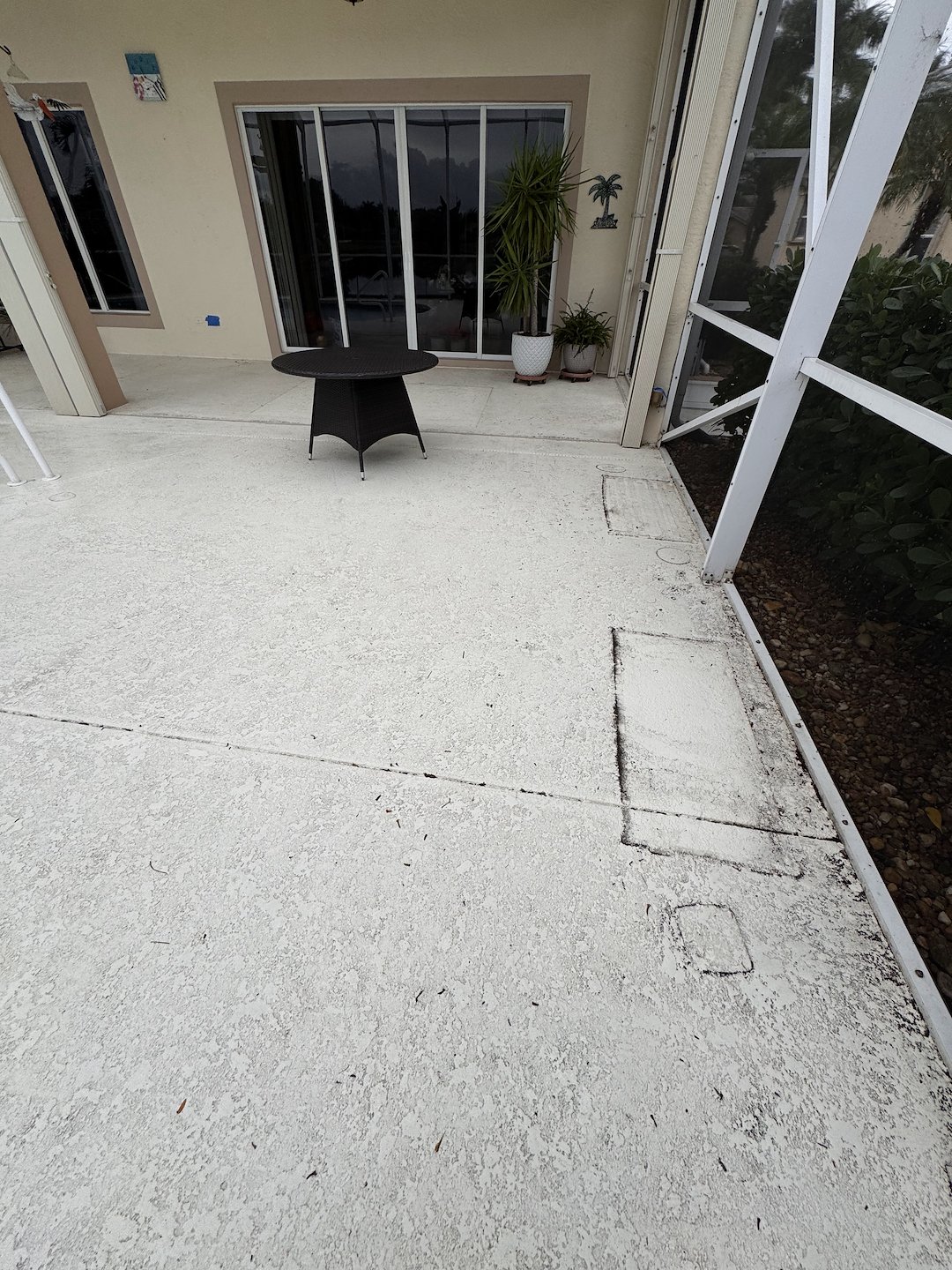 Pressure washing/pressure cleaning of lanai/pool enclosure and pool deck/floor located in Heritage at Baywinds community West Palm Beach, FL 33411